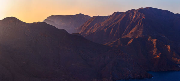 Scenic view of mountains against sky during sunset