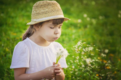 Portrait of young woman holding flower