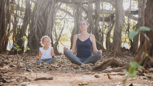 Woman sitting in the forest