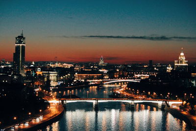 Illuminated buildings in city at night