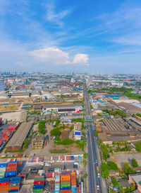 High angle view of city buildings against sky