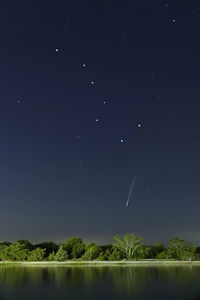 Scenic view of lake against star field at night