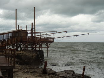 Trabucco on the stormy adriatic sea seen from the fisherman's bay of colonna beach