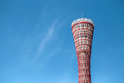 Low angle view of tower and building against sky