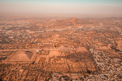 Aerial view of city against sky