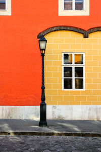 Red window on brick wall