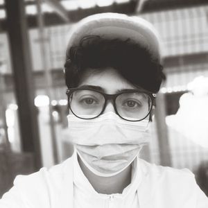 Close-up of portrait of man wearing surgical mask