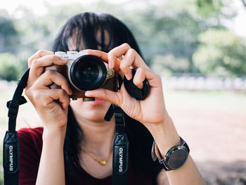 Woman photographing with camera
