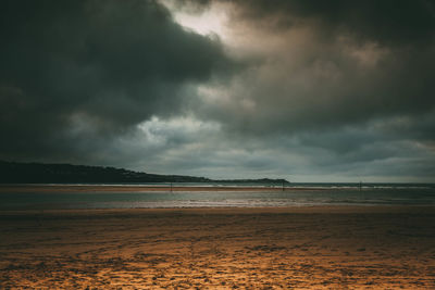 Scenic view of sea against cloudy sky