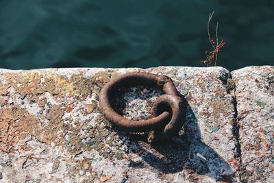 Close-up of rusty chain on wall