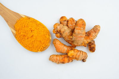 High angle view of orange on table against white background