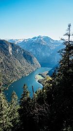 Scenic view of lake and mountains against clear sky