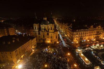 High angle view of city lit up at night