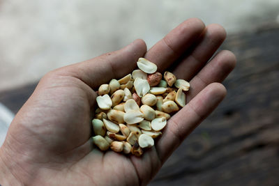 Cropped hand of person holding food