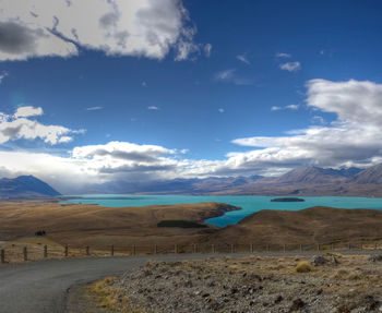 Scenic view of landscape against blue sky