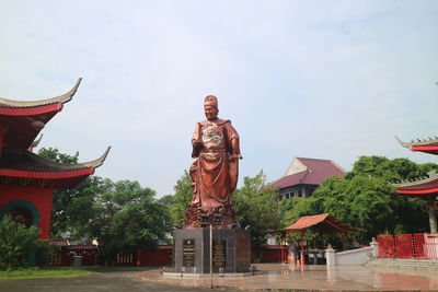 Low angle view of statue against sky