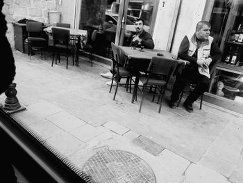 People sitting on table in cafe