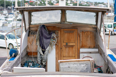 Old boat with wooden decorations and doors.