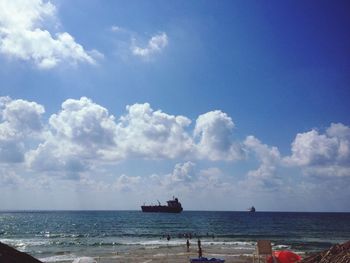 Scenic view of sea against cloudy sky