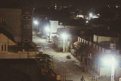 Illuminated street lights in city at night