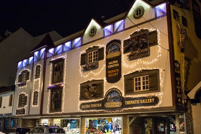 Low angle view of illuminated building at night