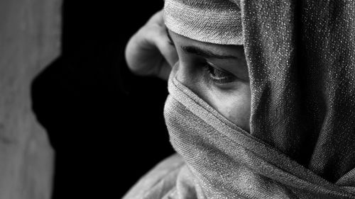 Close-up of young woman looking away