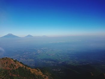 Scenic view of mountains against clear blue sky