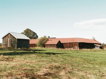 House on field against sky