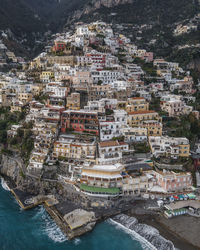 Aerial view of townscape by sea