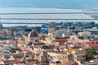 High angle view of townscape by sea