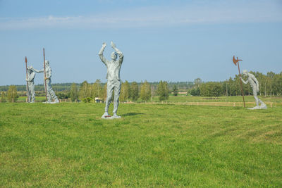 Trees on field against sky