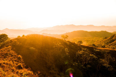 Scenic view of mountains against sky during sunset