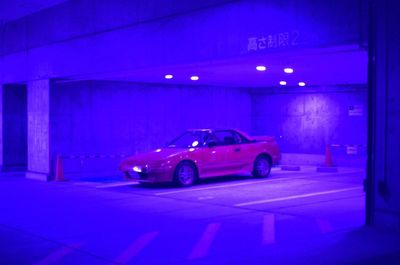 Digital composite image of illuminated car on road at night