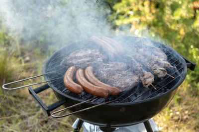 Close-up of meat on barbecue grill