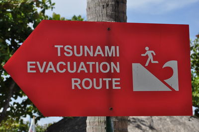 Close-up of warning sign on road