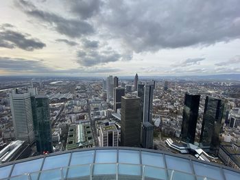 High angle view of modern buildings in city against sky