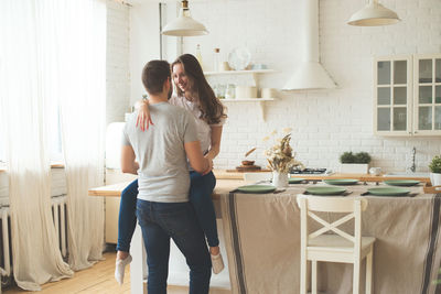 Friends standing on table