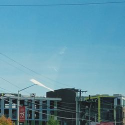 High section of building against clear blue sky