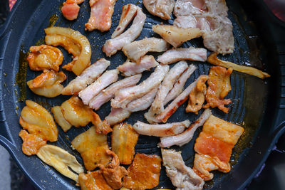 High angle view of meat in cooking pan