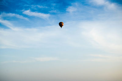 Low angle view of person paragliding