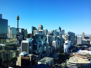 View of cityscape against blue sky