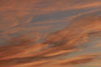 Low angle view of orange cloudy sky