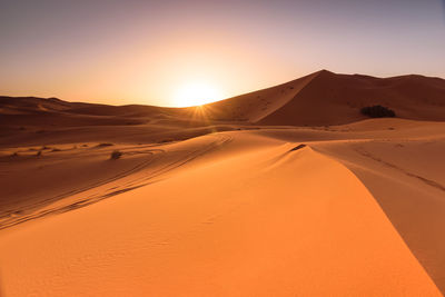 Scenic view of desert against clear sky