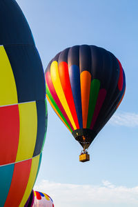 Low angle view of hot air balloon against blue sky