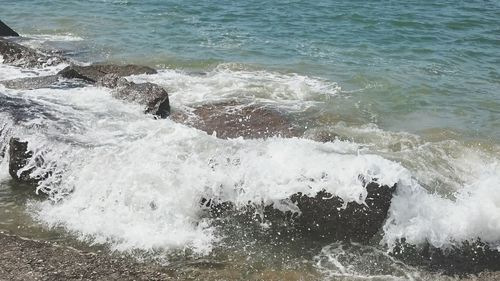 Waves splashing on rocks