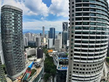 Modern buildings in city against sky