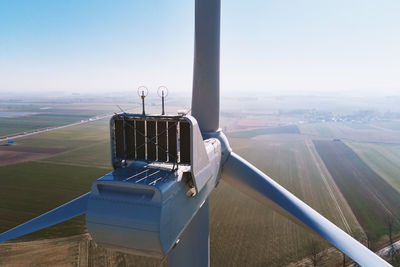 Aerial view of part of windmill turbine in countryside, green energy