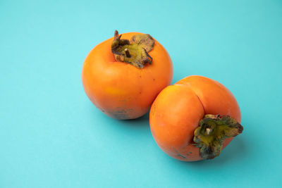 Close-up of tomatoes against blue background