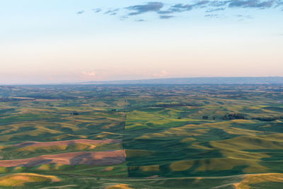 Aerial view of landscape against sky during sunset