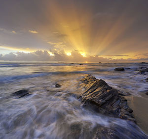 Scenic view of sea against sky during sunset